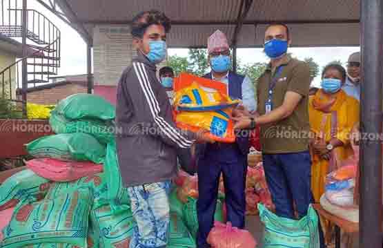 Relief distribution to flood-displaced families by Sarawal rural municipality